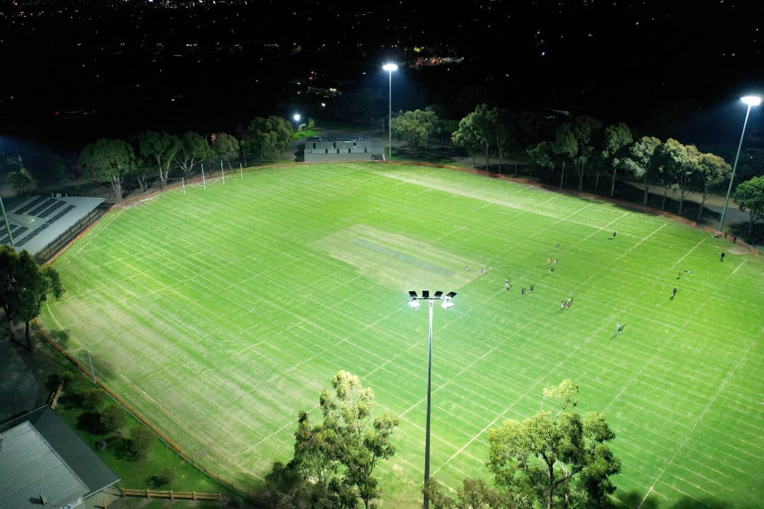 Football stadium LED lights with players under lights